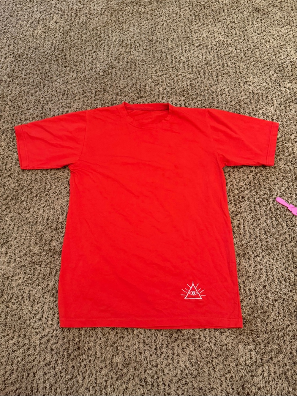 Red Graphic Tee with Small White Triangle Eye Logo